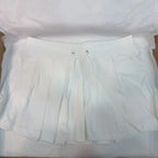 Mini jupe plissée grise avec cordon de serrage pour femmes