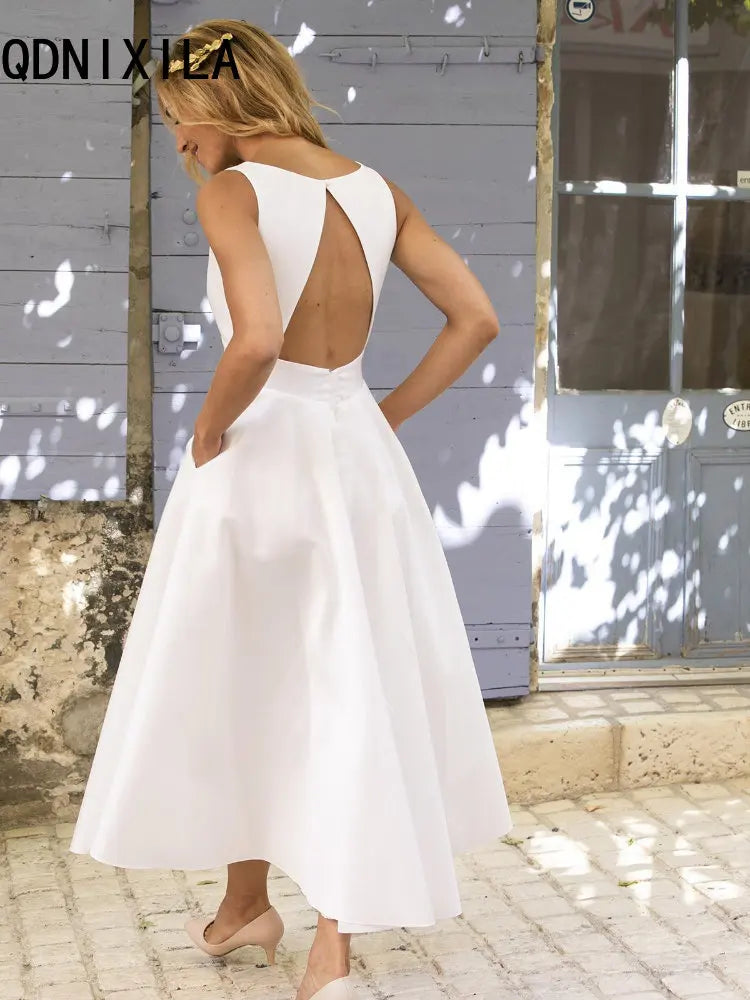 Robe mi-longue en Satin blanc pour femmes, Sexy, décolleté en v profond, dos nu, mode élégante, grand ourlet, sans manches