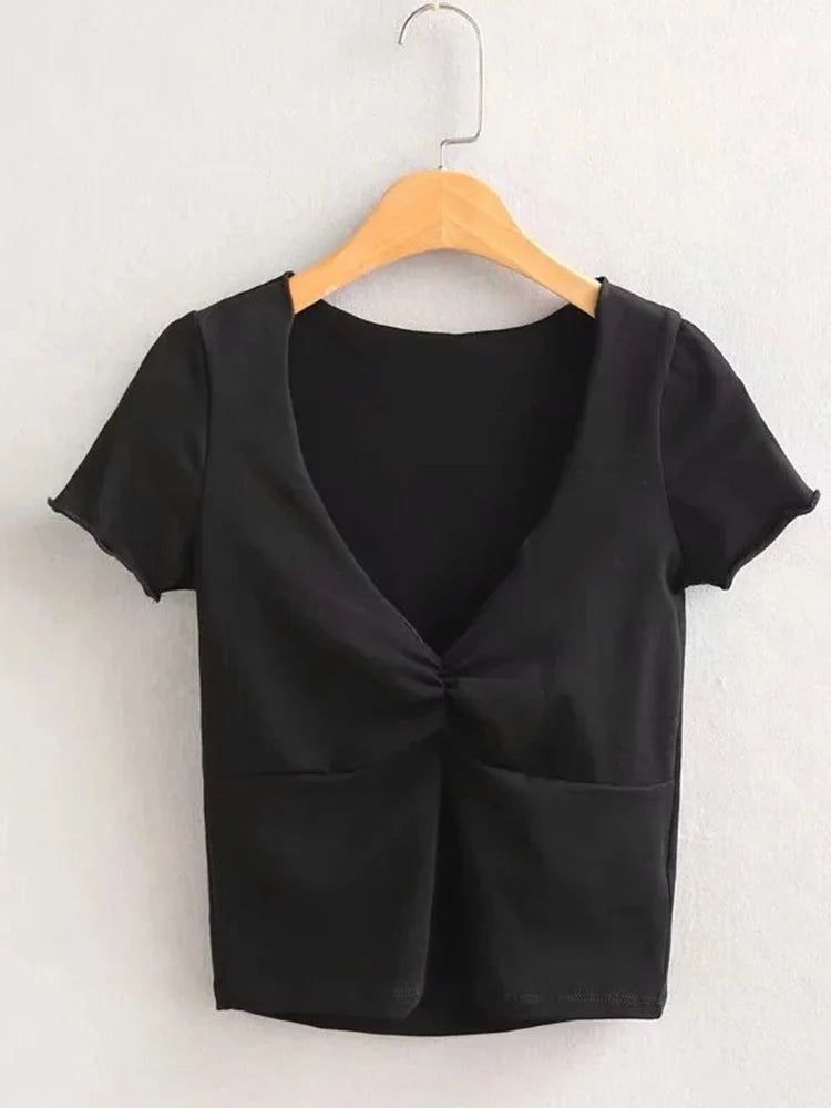 T-shirt ajusté doux et extensible à col en V pour femme avec une couture sous la poitrine